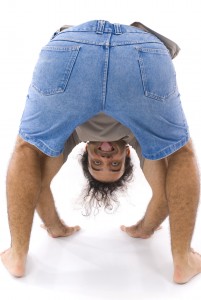 Man showing tongue upside down .
